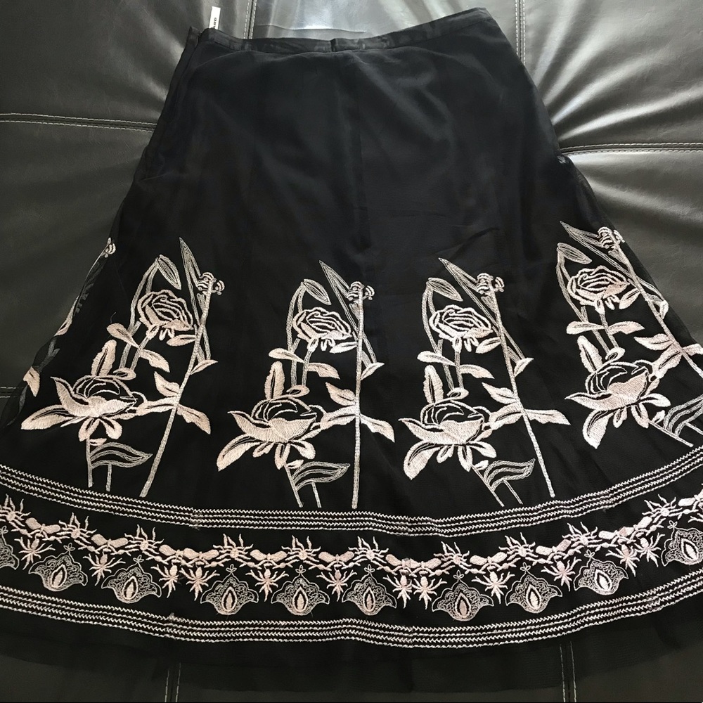 Women’s black skirt with white lace flower pattern